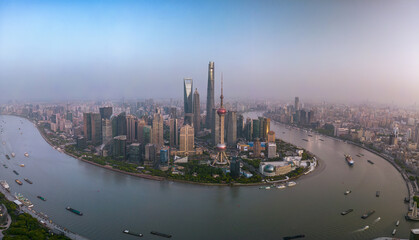 The drone aerial view of Lujiazui financial and trade zone at dusk, Pudong, Shanghai, China. Lujiazui is the largest financial zone in mainland China.