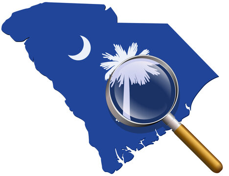 South Carolina map in colors of the state flag under magnifying glass (cut out)