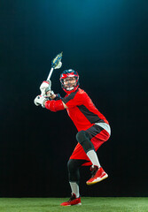 Plakat Lacrosse player, athlete in action. Download photo for sports betting advertisement. Sports and motivation vertical photo.