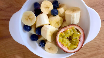 Healthy snack: bananas, blueberries and passion fruit