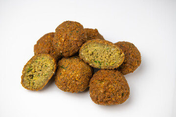 Whole and half falafel isolated on a white background closeup, High quality photo