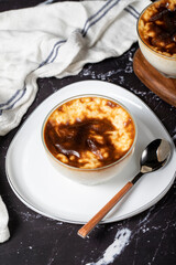 Rice pudding on a dark background. Rice pudding dessert made with milk. Turkish cuisine delicacies. Close up