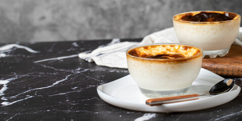 Rice pudding on a dark background. Rice pudding dessert made with milk. Turkish cuisine delicacies. Copy space. Empty space for text