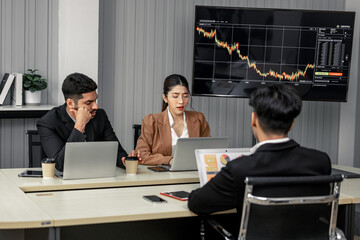 Financial advisors collaborate to assess a company's financial performance using data from its...