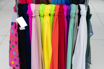 Assortment of colored fabrics in the store on the counter