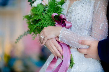 man groom in black suite hold hangs finger of muslim bride.concept for wedding card background, poster,Invitation card