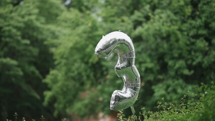 Air balloon in the form of a number three in the park