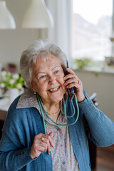 Portrait of senior woman with a smartphone.