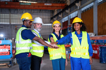 Confident Manager visit engineer teamwork at manufacture factory gathering hands portrait together