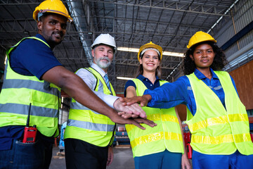 Confident Manager visit engineer teamwork at manufacture factory gathering hands portrait together