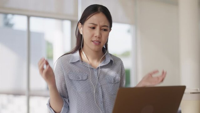 Young adult people asia woman work at hybrid workplace share office bored upset loss videocall anger annoy at low poor unreliable lost wifi router disconnect. Error bad slow speed signal outage issue.