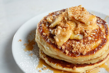 A view of a plate of apple pancakes.