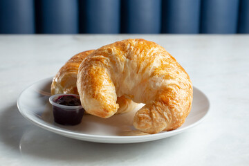 A view of a plate of croissants.