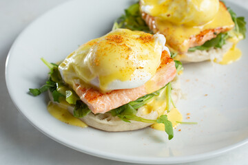 A view of a plate of salmon Benedict.