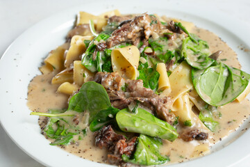 A view of a plate of short rib pappardelle.