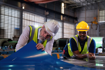 Plant manager visit engineer in factory at production line discuss on quality assurance improvement