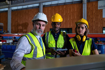 Plant manager visit engineer in factory at production line discuss on quality assurance improvement