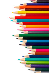 Fototapeta premium Assortment of coloured pencils with shadow on white background