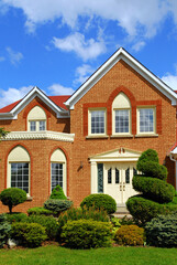 Residential house with beautiful landscaping in front yard