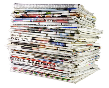 large stack of folded newspapers ready for recycling