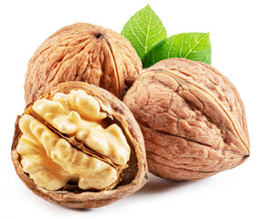 Whole walnut and walnut kernel with leaves isolated on white background.