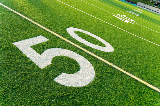 Closeup of 50 yard line on American football field