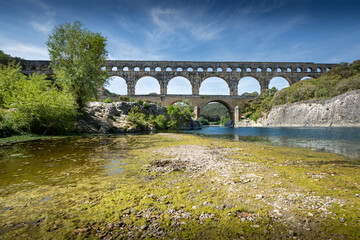 Fototapeta na wymiar Three-tiered aqueduct Pont du Gard and natural park - Nimes, France