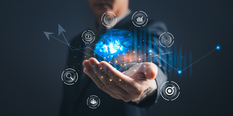 A person holding global and graph stock to plan in e-business, the use of online digital network technology in business, buying and selling commerce online digital marketplace