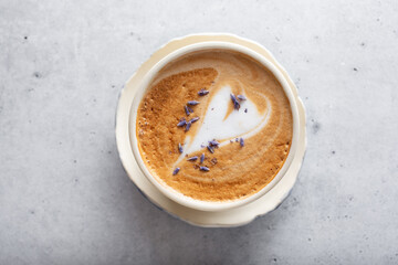 A top down view of a lavender cappuccino.