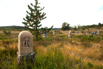 Vintage cemetary with ancient headstone