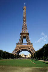 Fototapeta na wymiar The incredible Eiffel Tower in Paris on a warm summer day.