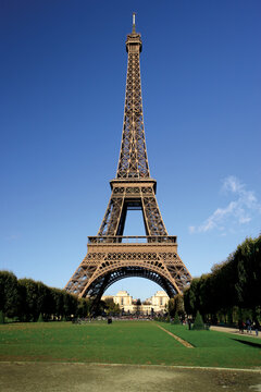 The incredible Eiffel Tower in Paris on a warm summer day.