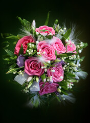 Wedding bouquet from roses on a green background
