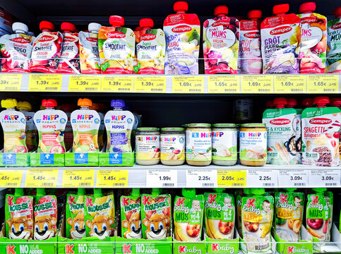 LATVIA, RIGA, MAY, 2023: Hipp baby food and other on shelf  in a supermarket at Riga, Latvia. Hipp is a German brand of organic food for babies and children. Food supplements.