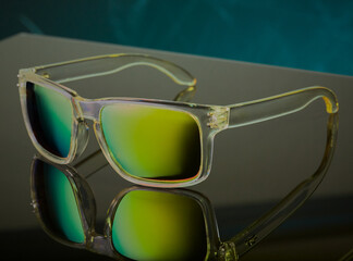 Cool polarised sunglasses on a reflective surface with a nice gradient on the lenses.