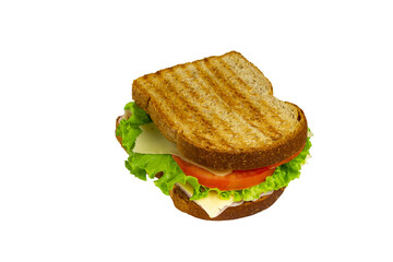 Sandwich with Ham, cheese, lettuce, and tomatoes inside of a loaf bread