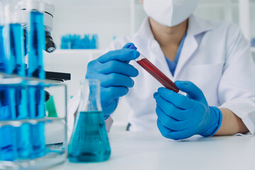 Medical Development Laboratory: Caucasian Female Scientist Looking Under Microscope, Analyzes Petri Dish Sample. Specialists Working on Medicine, Biotechnology Research in Advanced Pharma Lab