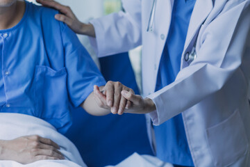 doctor check up after surgery. doctor touching patient hand and consoling. - obrazy, fototapety, plakaty
