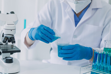 Fototapeta premium Medical Development Laboratory: Caucasian Female Scientist Looking Under Microscope, Analyzes Petri Dish Sample. Specialists Working on Medicine, Biotechnology Research in Advanced Pharma Lab