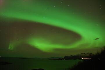 Weak display on a stormy night outside of Bodø