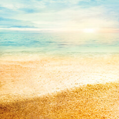 Beach summer background  with fine golden sand, sunset, sea and copyspace