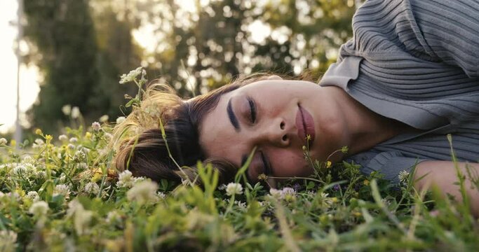 Relaxed woman resting on the grass