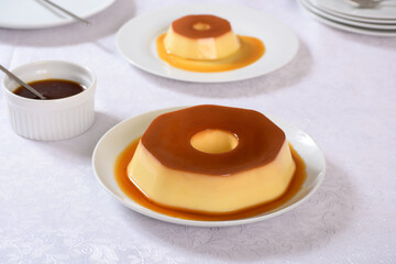 A plate of flan with caramel sauce on it