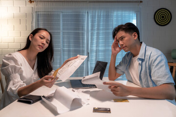 Asian family with cumulative stress from financial problems.