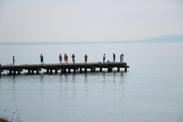 Fototapeta na wymiar people walking on the pier