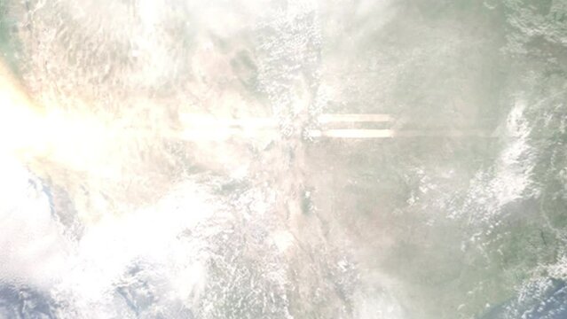 Earth zoom in from outer space to city. Zooming on Los Lunas, New Mexico, USA. The animation continues by zoom out through clouds and atmosphere into space. Images from NASA
