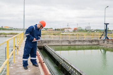 Water plant maintenance technicians, mechanical engineers check the control system at the water treatment plant.