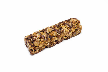 Muesli bar on a white isolated background in the center. Whole grain energy bar with chocolate. Healthy food in the form of a sweet healthy bar. Healthy quick snack