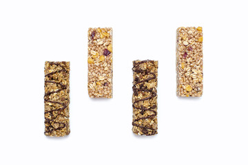 A set of different muesli bars on a white isolated background. A tasty and healthy snack in the form of whole grain oatmeal nut and chocolate bars with berries. Sweet and healthy snack