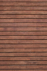 Vertical image a beautiful wooden background from boards painted in brown.